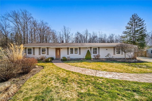 ranch-style home with a front yard