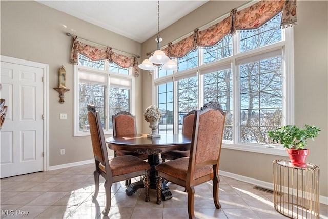 dining room featuring a wealth of natural light, visible vents, and baseboards