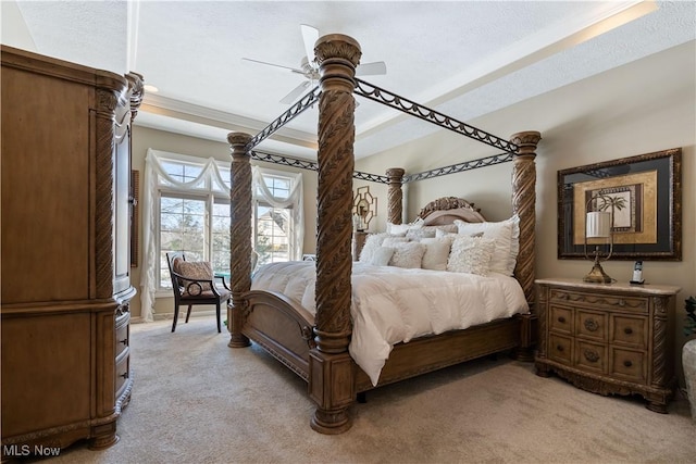 bedroom with light colored carpet, a textured ceiling, crown molding, and ceiling fan