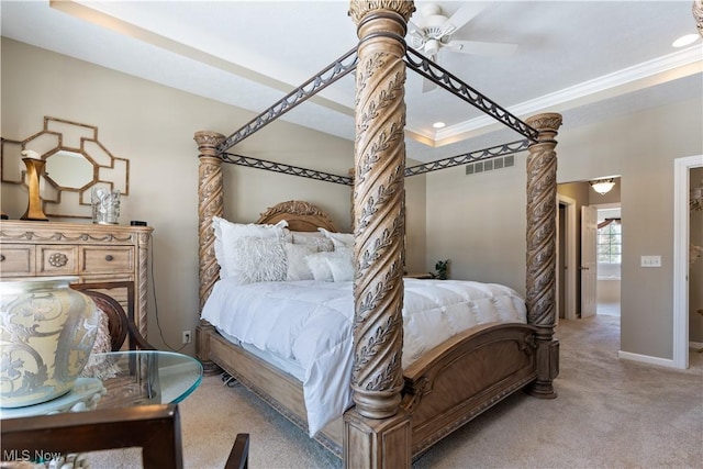 bedroom with visible vents, a ceiling fan, carpet floors, crown molding, and baseboards