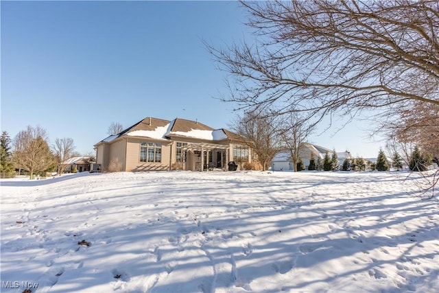 view of snow covered house