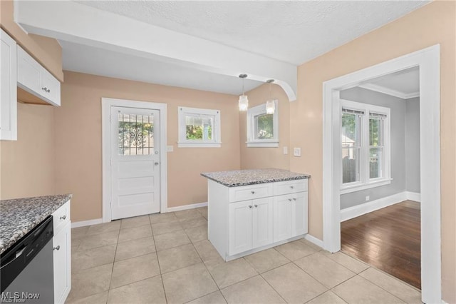 kitchen with dishwasher, light stone counters, baseboards, and white cabinetry