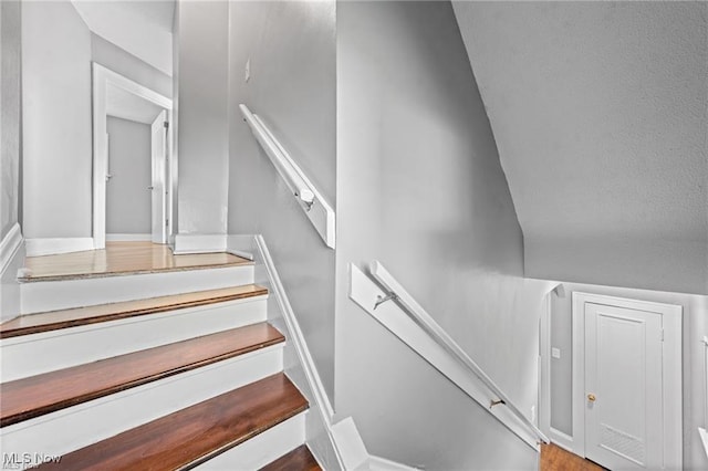 stairs featuring baseboards