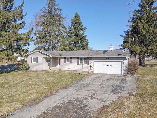 single story home with a front lawn, a garage, and aphalt driveway