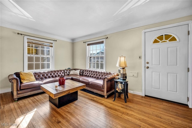 living room featuring light wood-style flooring and baseboards