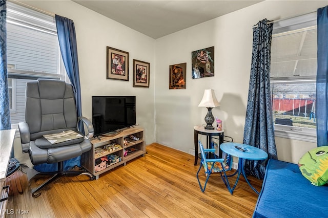 living area with hardwood / wood-style floors