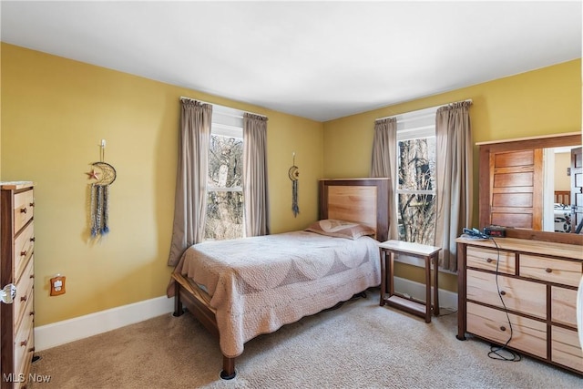 carpeted bedroom with baseboards