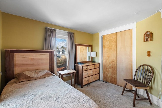 carpeted bedroom featuring a closet