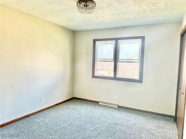 empty room featuring baseboards, visible vents, and carpet floors