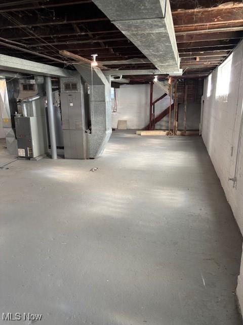 below grade area featuring heating unit