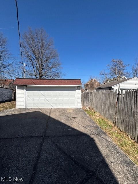 detached garage with fence