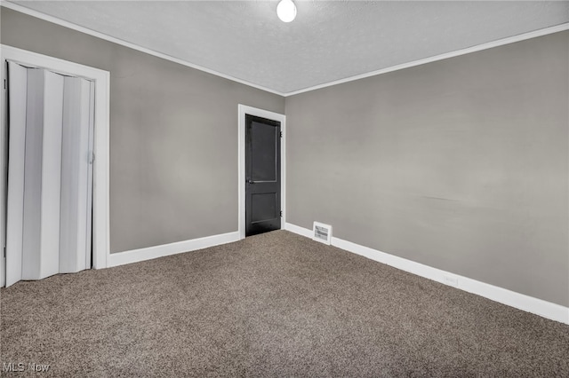 12117 Craven Ave, Cleveland, OH 44105 - unfurnished bedroom featuring carpet flooring, crown molding, baseboards, a textured ceiling, and a closet