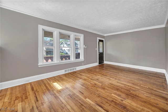 12117 Craven Ave, Cleveland, OH 44105 - unfurnished room with a textured ceiling, baseboards, hardwood / wood-style floors, and crown molding