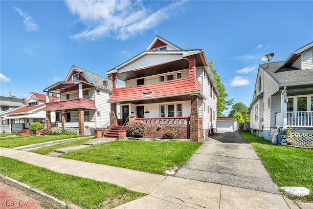 12117 Craven Ave, Cleveland, OH 44105 - view of front facade with a porch, a front yard, an outbuilding, a garage, and a balcony