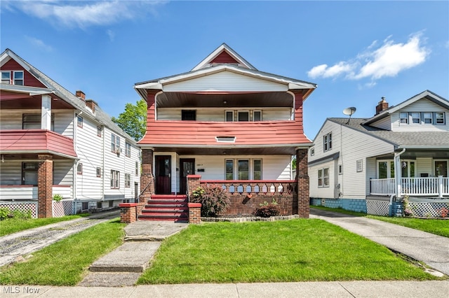 12117 Craven Ave, Cleveland, OH 44105 - view of front of house with covered porch, a balcony, and a front lawn