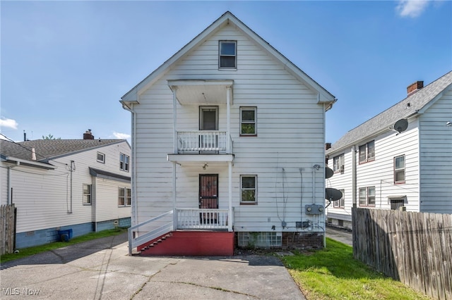 12117 Craven Ave, Cleveland, OH 44105 - rear view of house featuring a balcony and fence