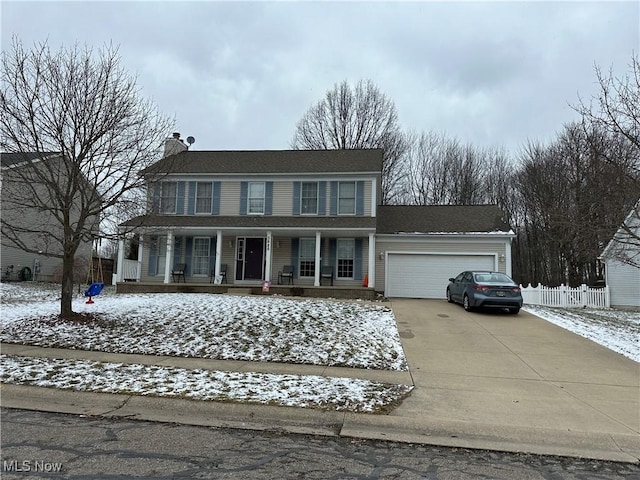 view of front of house with fence, concrete driveway, covered porch, a chimney, and an attached garage