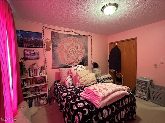 bedroom featuring a textured ceiling