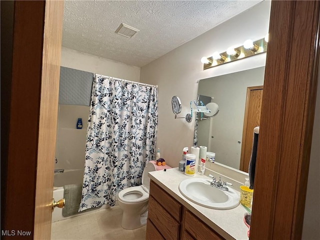 full bath featuring visible vents, toilet, vanity, a textured ceiling, and shower / bathtub combination with curtain