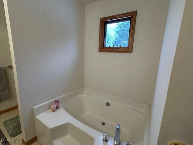 bathroom with a garden tub