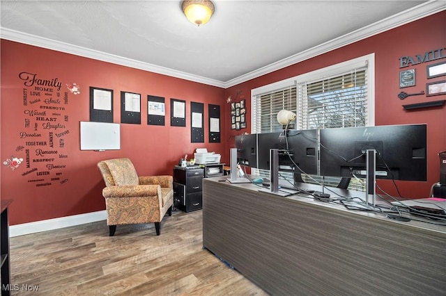 office space with crown molding, baseboards, and wood finished floors