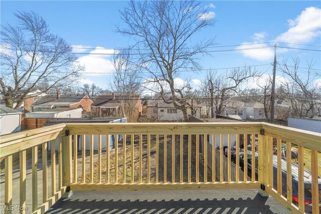 wooden deck featuring a residential view