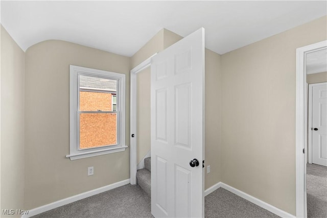 bedroom featuring baseboards and carpet flooring