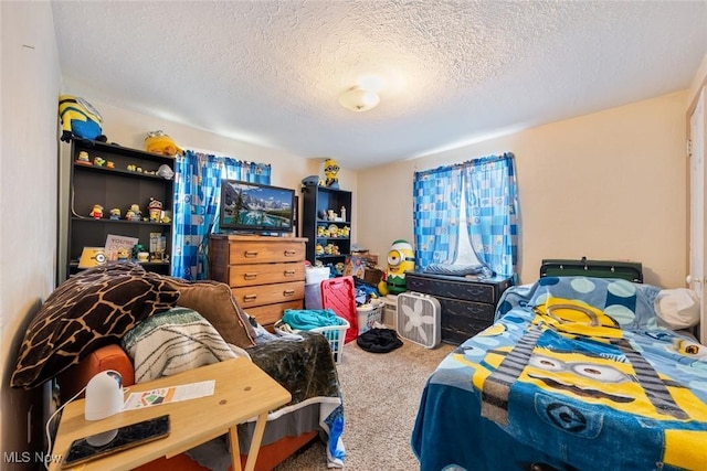 carpeted bedroom featuring a textured ceiling