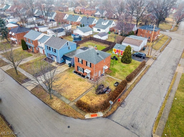 birds eye view of property with a residential view