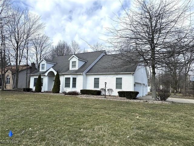 cape cod-style house with a front yard and a garage