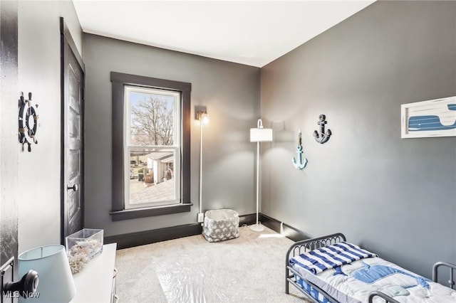 carpeted bedroom with baseboards