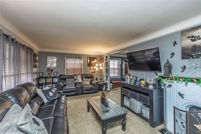 carpeted living area featuring a textured ceiling