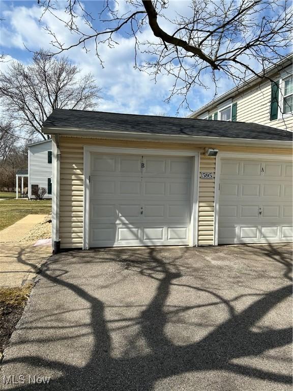 garage featuring driveway