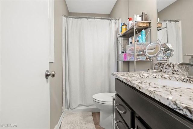 full bath with vanity, a shower with shower curtain, toilet, and wood finished floors