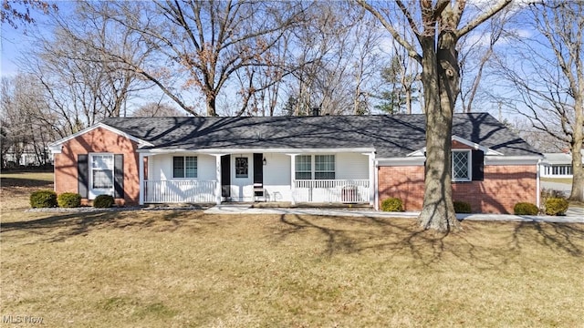 ranch-style home featuring brick siding, a porch, and a front lawn