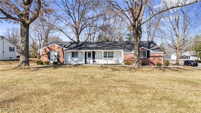 ranch-style house with a front lawn and a porch