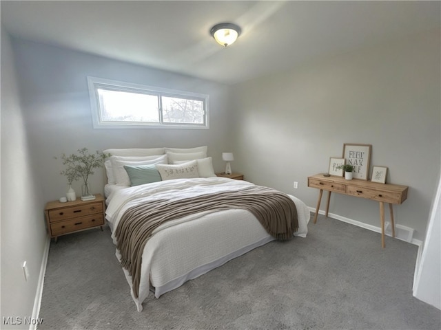 carpeted bedroom with baseboards