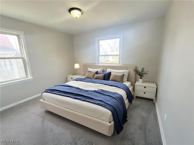 bedroom featuring baseboards and carpet floors