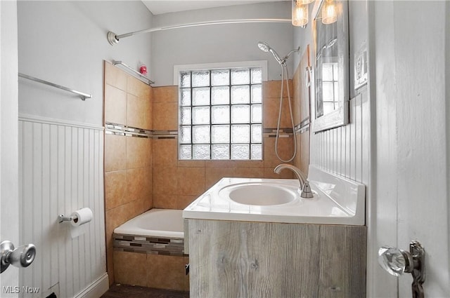 bathroom with tub / shower combination and vanity