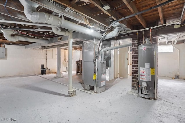 basement featuring visible vents, gas water heater, electric panel, heating unit, and a sink