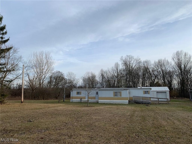 exterior space featuring a front lawn