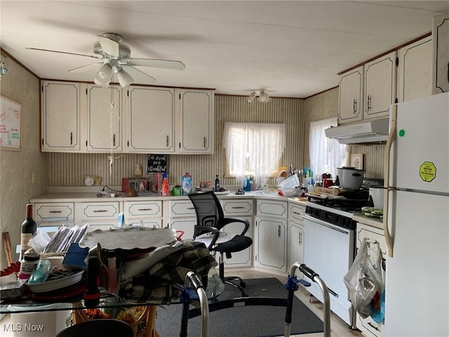 kitchen featuring under cabinet range hood, white appliances, white cabinets, light countertops, and ceiling fan