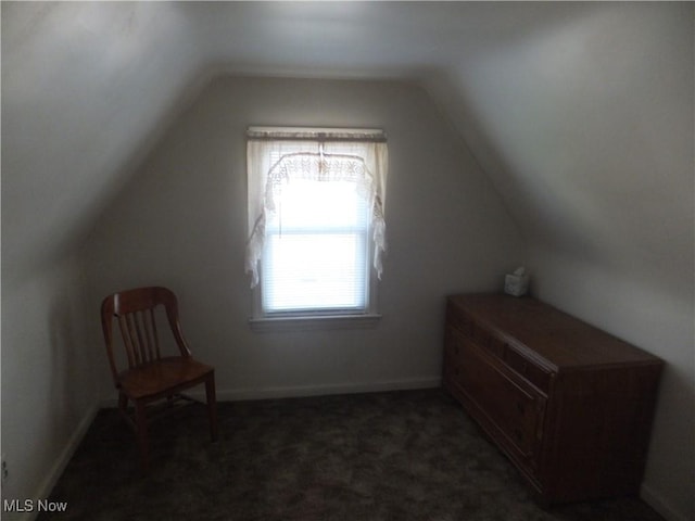 bonus room with lofted ceiling, carpet flooring, and baseboards