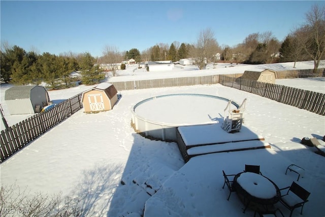 exterior space featuring an outbuilding, a storage unit, and a fenced backyard