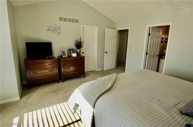 bedroom featuring lofted ceiling, light colored carpet, visible vents, and baseboards