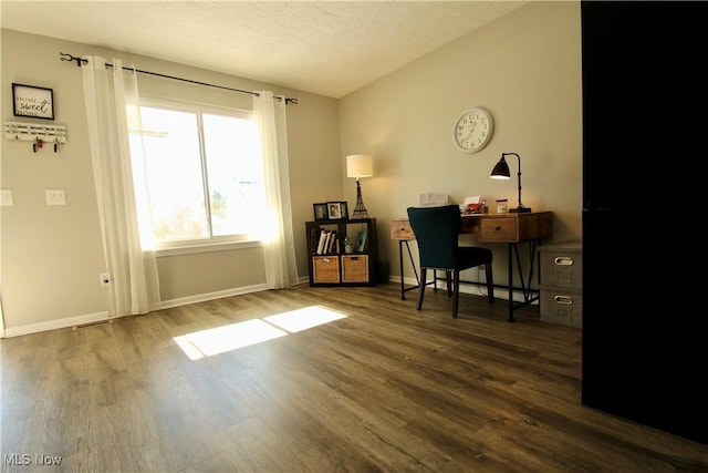 office with baseboards, a textured ceiling, lofted ceiling, and wood finished floors