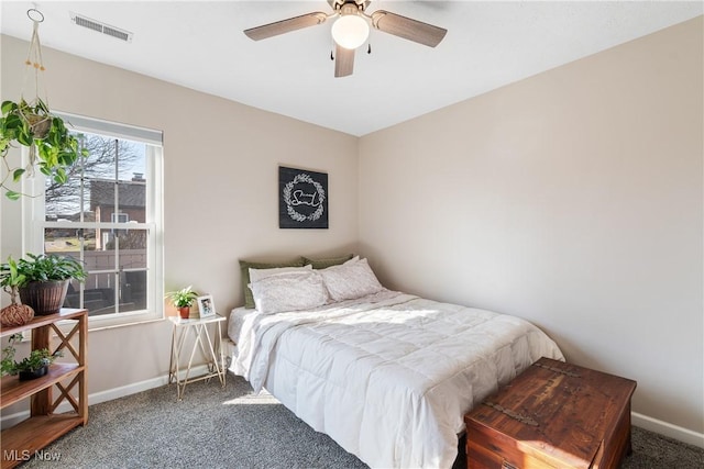 bedroom featuring baseboards, visible vents, carpet floors, and ceiling fan