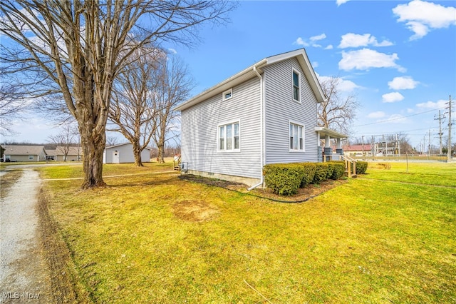 view of property exterior with a lawn