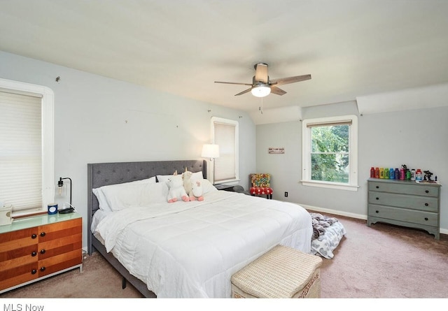 carpeted bedroom with a ceiling fan and baseboards