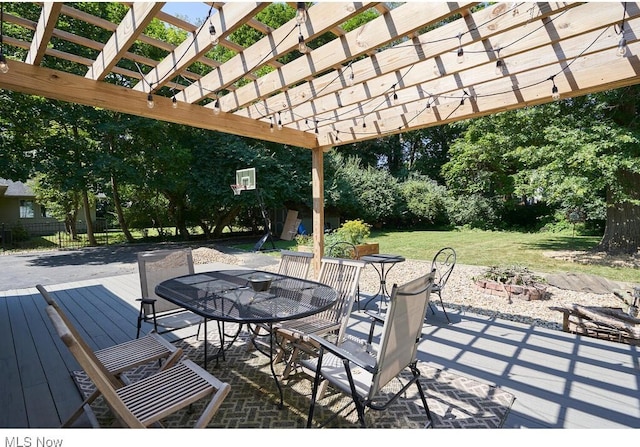 view of patio / terrace with a pergola and outdoor dining area